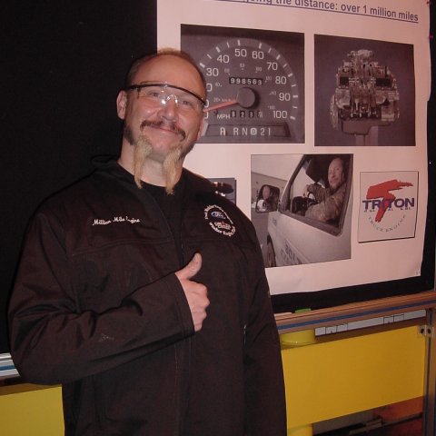 Doug in front of poster with flash-A